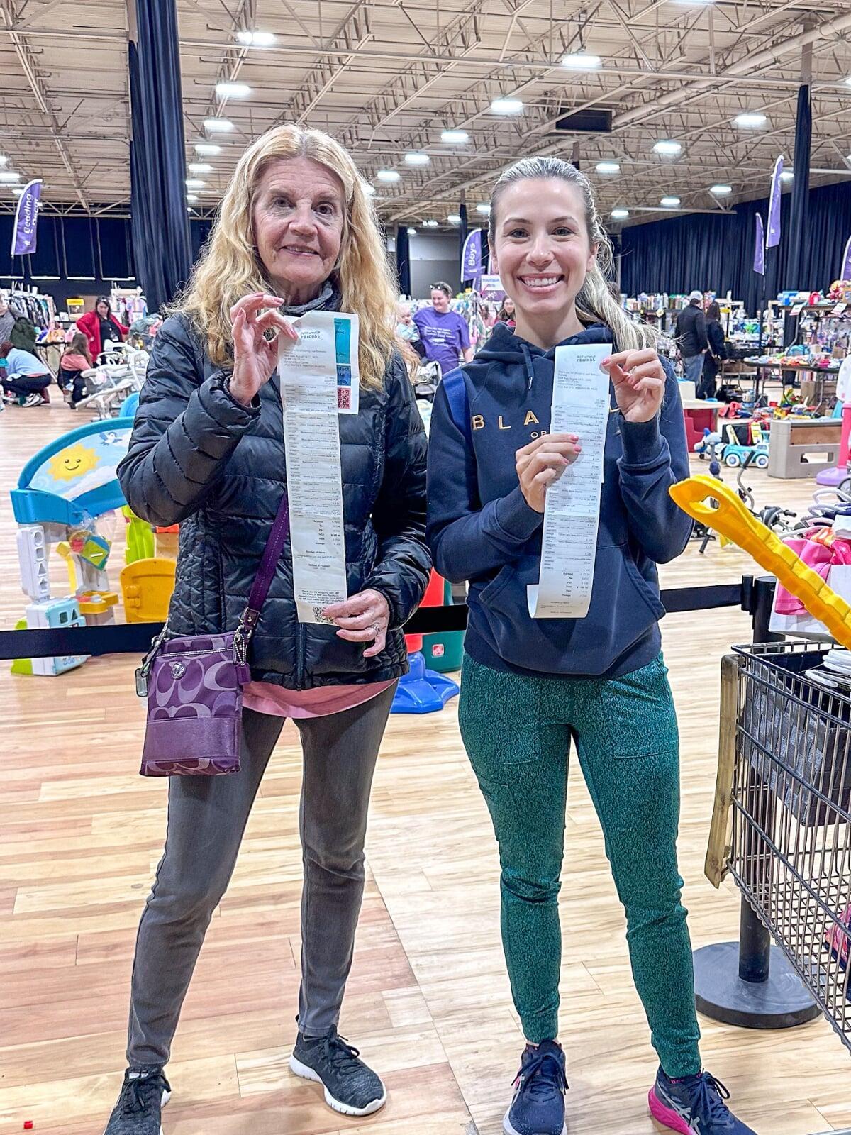 A group of shoppers wearing masks for safety reasons gathers together at the sale to shop.